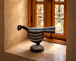 Wooden partridge, symbol of the Gambra Palace